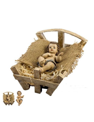 Niño Jesús en cuna realizado en resina y madera